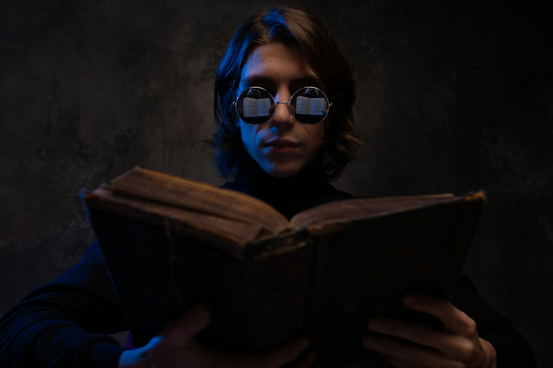 detective reading old book