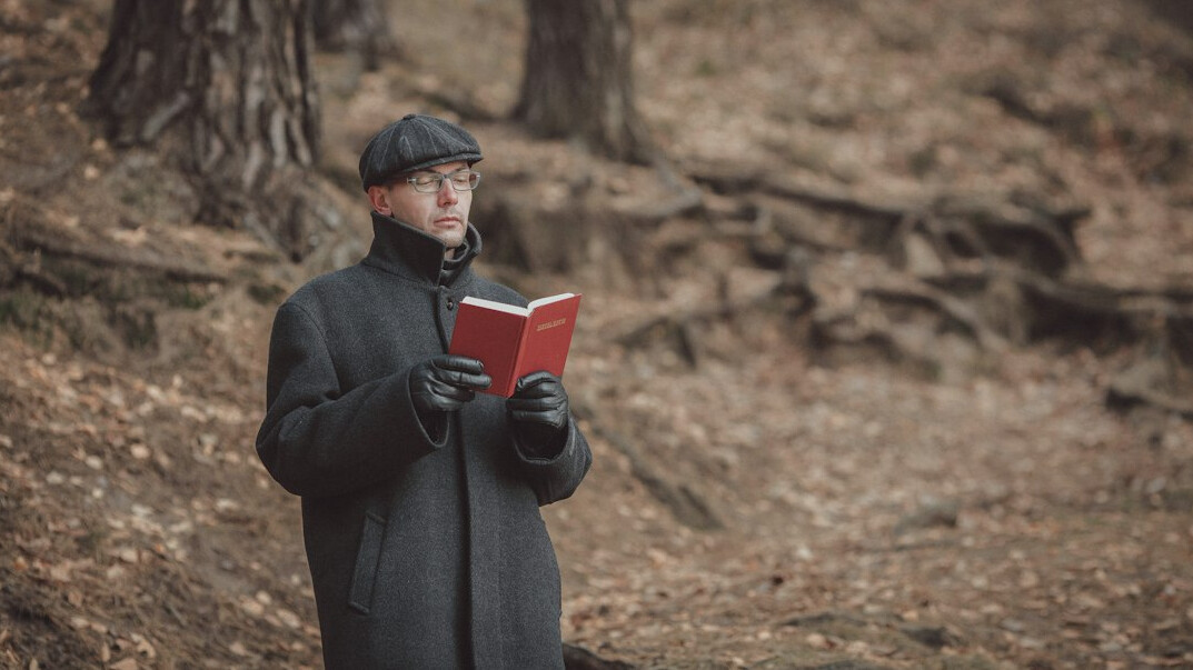detective reading old book